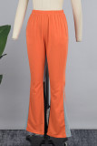 Pantaloni patchwork convenzionali a vita bassa regolari con tasche patchwork color block rosso mandarino