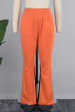 Rojo mandarina Street Pantalones de patchwork convencionales con bloques de color y bolsillo con patchwork de cintura baja regular