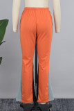 Pantaloni patchwork convenzionali a vita bassa regolari con tasche patchwork color block rosso mandarino