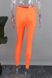 Pantaloni in tinta unita a matita a vita alta skinny casual arancioni con patchwork scavato solido