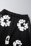 Zwarte straatprint patchwork zak met rits, rechte lage taille, rechte broek met volledige print