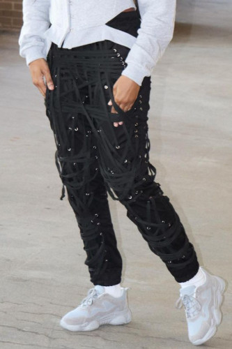 Zwarte straat-patchwork-broek met trekkoord en gekruiste bandjes met mid-taille potlood-patchwork-broek