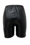 Pantalones cortos de color sólido convencionales de cintura media ajustados de retazos lisos callejeros negro