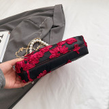 Schwarze Vintage-Taschen mit eleganten Blumen und Perlenfalten