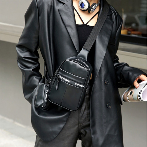Schwarze Patchwork-Reißverschlusstaschen mit Tagesdruck