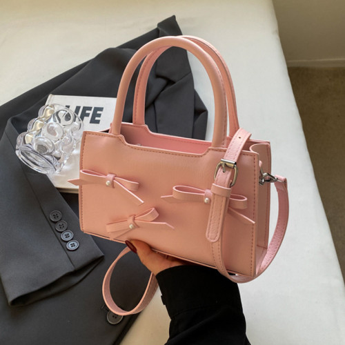 ピンクの甘いシンプルさのソリッドとリボンのコントラスト バッグ