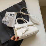 Solido dolce semplicità bianco crema con borse a contrasto con fiocco