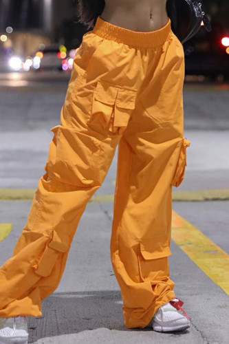 Orangefarbene, lässige, einfarbige Hose mit Patchwork-Tasche, lockerer mittlerer Taille und weitem Bein