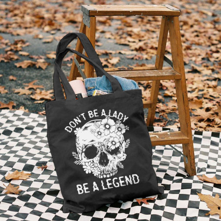 Black DON'T BE A LADY BE A LEGEND SKULL AND FLOWERS PRINTED BAG