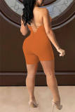 Yellow Sexy Solid Hollowed Out Backless Strap Design Halter Skinny Romper