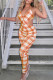 Orange Fashion Sexy Plaid Print Backless Strap Design V Neck Skinny Jumpsuits
