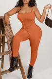 Orange Sexy Solid Patchwork Backless Halter Skinny Jumpsuits