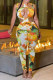 Yellow Fashion Sexy Print Hollowed Out Skinny Jumpsuits