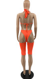 Orange Sexy Solid Hollowed Out Backless Halter Skinny Romper