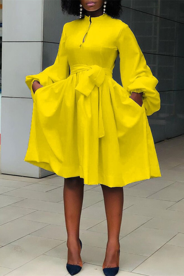 Yellow Fashion Casual Solid Bandage O Neck Long Sleeve Dresses