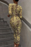 Yellow Fashion Sexy Print Hollowed Out Frenulum O Neck Long Sleeve Dresses