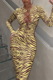 Yellow Fashion Sexy Print Hollowed Out Frenulum O Neck Long Sleeve Dresses