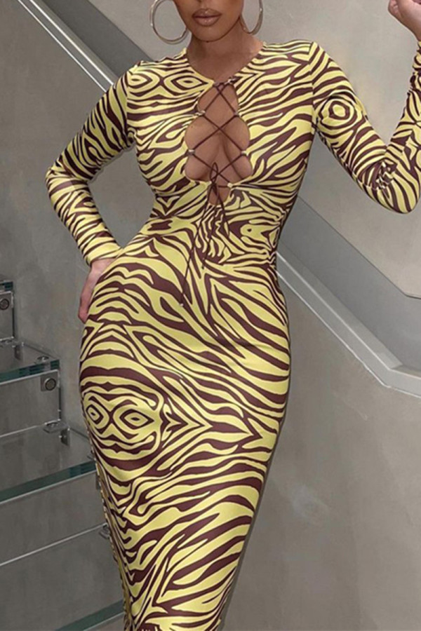 Yellow Fashion Sexy Print Hollowed Out Frenulum O Neck Long Sleeve Dresses