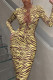 Yellow Fashion Sexy Print Hollowed Out Frenulum O Neck Long Sleeve Dresses