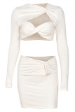 Light Apricot Fashion Sexy Solid Hollowed Out Patchwork Asymmetrical Long Sleeve Two Pieces