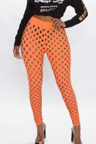 Orange Sexy Casual Solid Hollowed Out See-through Regular Pencil Patchwork Bottoms