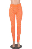 Orange Sexy Casual Solid Hollowed Out See-through Regular Pencil Patchwork Bottoms