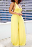 Yellow Sexy Solid Patchwork Backless Halter Straight Jumpsuits