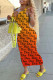 Orange Fashion Street Print Letter V Neck One Step Skirt Dresses
