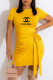 Yellow Fashion Sexy Print Letter O Neck One Step Skirt Dresses