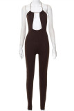 Brown Fashion Sexy Solid Bandage Hollowed Out Backless O Neck Skinny Jumpsuits