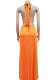 Orange Sexy Solid Bandage Hollowed Out Backless Slit Halter Straight Dresses