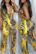 Yellow Sexy Casual Print Backless Spaghetti Strap Skinny Jumpsuits