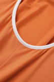 Orange Sexy Casual Solid Hollowed Out Backless V Neck Skinny Jumpsuits