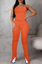Orange Sexy Casual Solid Bandage Backless Slit Spaghetti Strap Skinny Jumpsuits