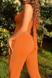Orange Sexy Solid Bandage Backless Halter Skinny Jumpsuits