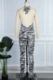 Rose Red Sexy Casual Print Bandage Backless Halter Skinny Jumpsuits
