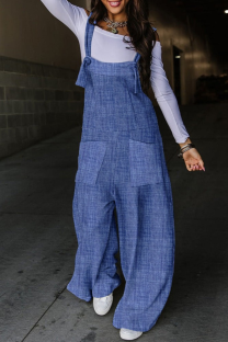 The cowboy blue Street Print Patchwork Pocket Knotted Spaghetti Strap Loose Jumpsuits