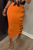 Orange Sexy Solid Hollowed Out Skinny Mid Waist Pencil Solid Color Bottoms