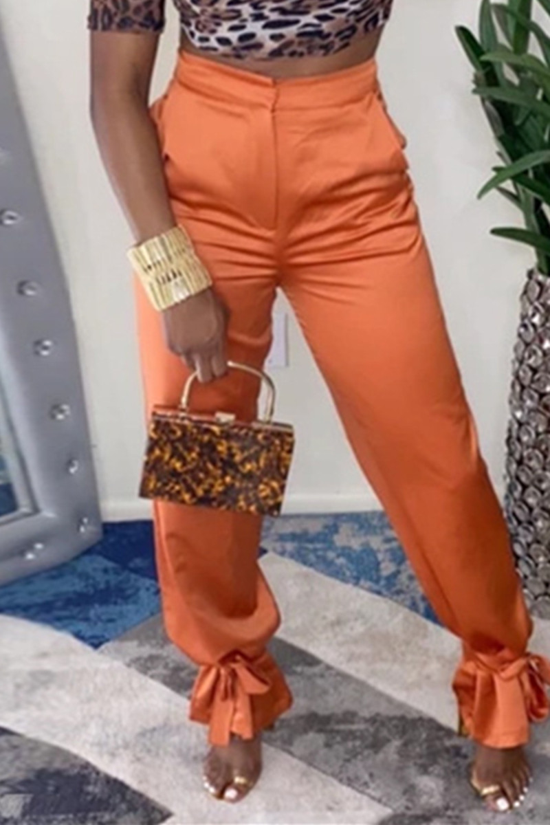 orange belted trousers