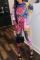 Multicolor Sexy Print Hollowed Out Patchwork Frenulum O Neck Skinny Jumpsuits