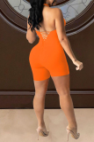 Orange Sexy Solid Hollowed Out Backless Strap Design Halter Skinny Romper