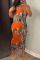 Orange Sexy Print Hollowed Out Patchwork Spaghetti Strap One Step Skirt Dresses
