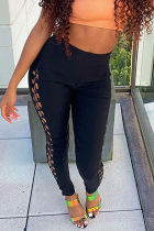 Black Sexy Solid Hollowed Out Skinny Mid Waist Pencil Solid Color Bottoms