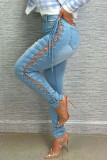 Sexy Street Solid Ripped Bandage Hollowed Out Patchwork High Waist Denim Jeans