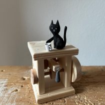 Cat Wanting to Drop a Cup